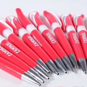 Red and white branded advertising pens arranged diagonally with silver-colored tips