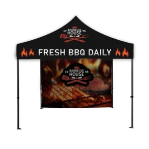 Black canopy tent with Fresh BBQ Daily lettering and a full-color barbecue-themed back wall