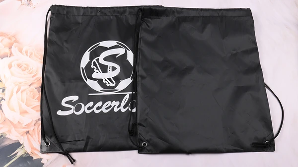 Two black drawstring bags showing a white logo front and a plain reverse side