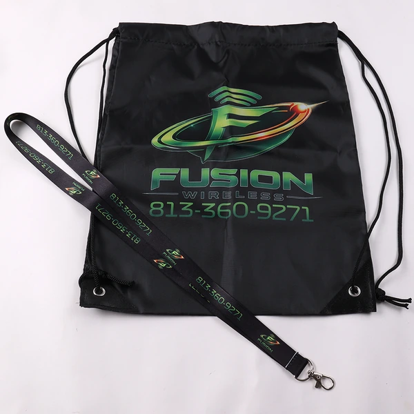 Black drawstring bag with a green logo and matching printed lanyard displayed diagonally