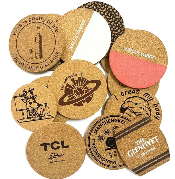 Assorted round and square cork coasters featuring printed logos, lettering and graphic designs